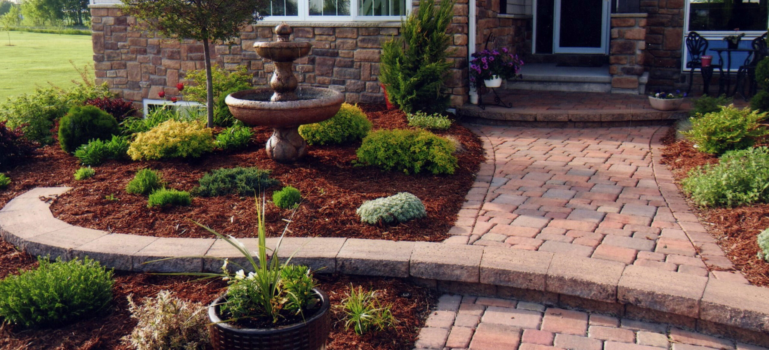 front yard landscaping idea with fountain