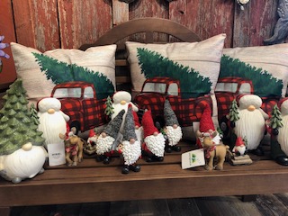 decorative pillows and gnome statues