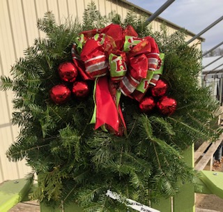 Christmas wreath with red ribbons and red bells